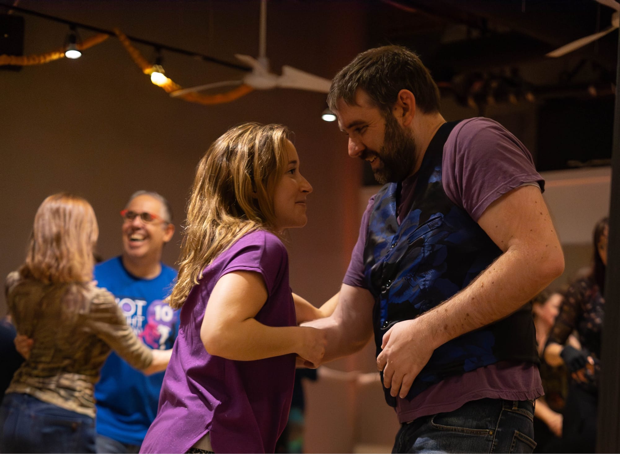 2 couples dancing and smiling